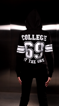 Warm jumpsuit 69 black, back view: COLLEGE 69 print and hood | THE ONE