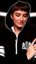 Embroidered crest and striped sleeves on the 69 black jumpsuit, hood up | THE ONE