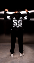 Men's warm jumpsuit 69 black, back view: COLLEGE 69 print, moves freely with arms raised | THE ONE