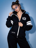 69 black jumpsuit with hood and crest, close-up | THE ONE
