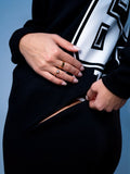 Zippered pocket on the 69 black jumpsuit, close-up | THE ONE