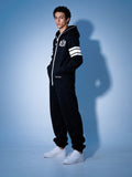 Men's 69 black jumpsuit, three-quarter view: striped sleeves | THE ONE