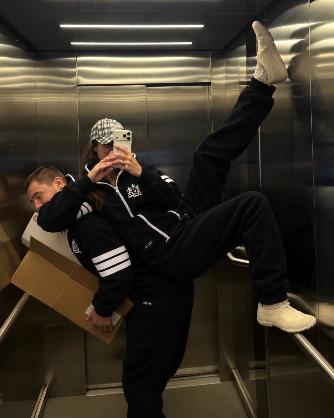 Men's 69 black jumpsuit in an elevator, high kick: moves freely | THE ONE