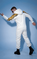Angel white jumpsuit in motion: gold wings on the arms, doesn't restrict movement | THE ONE