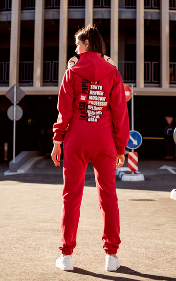 Warm jumpsuit Casa de papel red, back view: city names print, outdoors in the city | THE ONE
