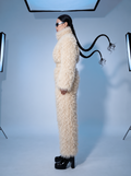 Everest faux fur jumpsuit, milk white — AI concept visualisation, not a photo of the finished piece