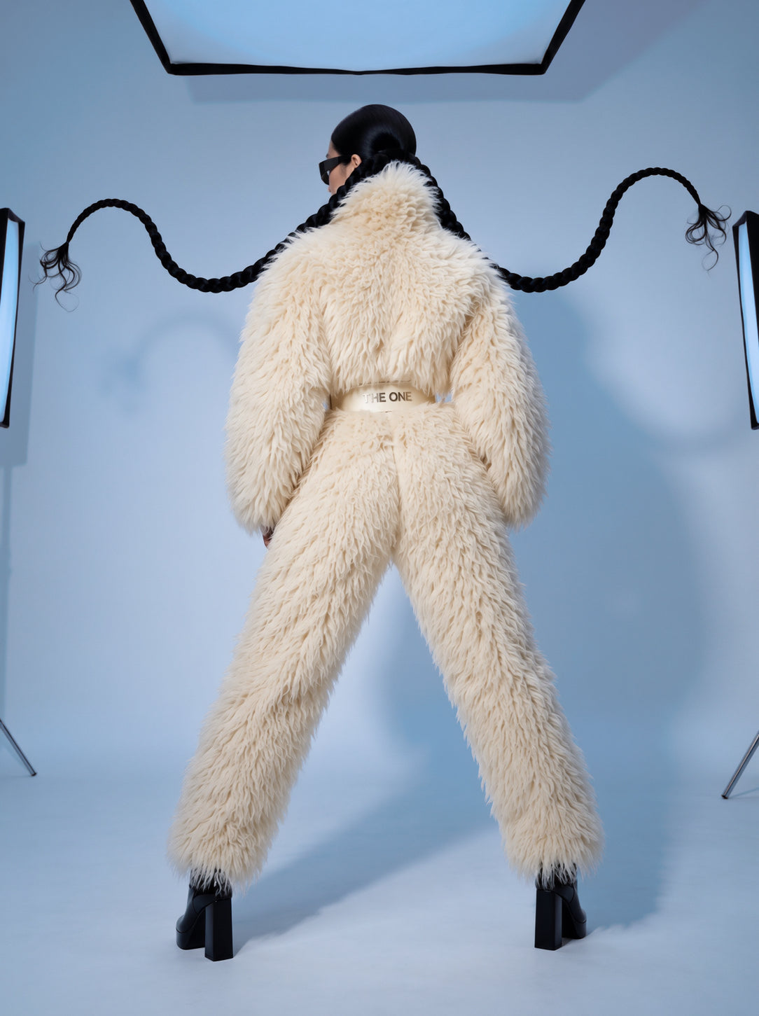 Everest faux fur jumpsuit, milk white — AI concept visualisation, not a photo of the finished piece