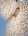 Everest faux fur jumpsuit, milk white — AI concept visualisation, not a photo of the finished piece