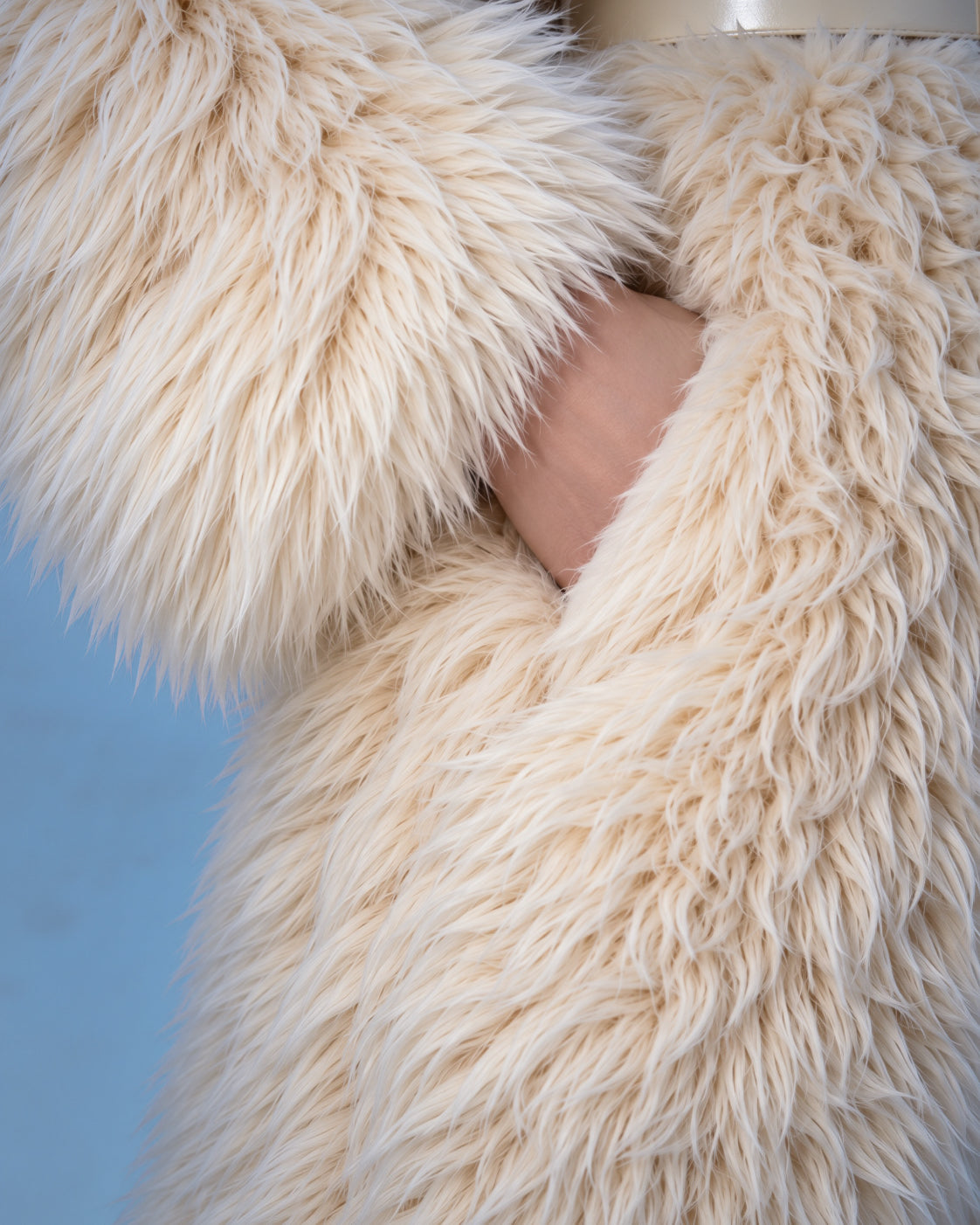 Everest faux fur jumpsuit, milk white — AI concept visualisation, not a photo of the finished piece