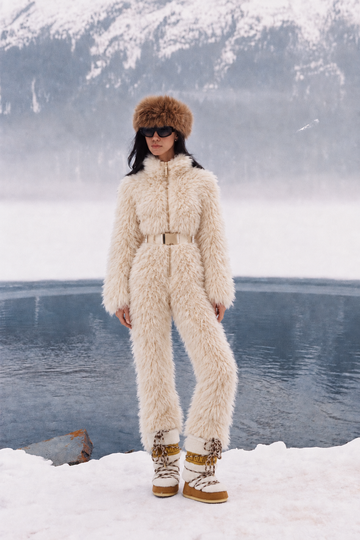 Everest faux fur jumpsuit, milk white — AI concept visualisation, not a photo of the finished piece