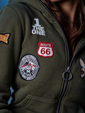 Вишиті нашивки Route 66 і лого THE ONE на грудях комбінезона Harley хакі