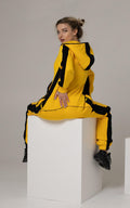 Kill Bill yellow jumpsuit, sitting: nothing rides up, lower back covered | THE ONE