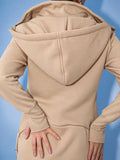 Ninja beige jumpsuit, back close-up: one-piece cut, hood | THE ONE