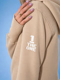 THE ONE logo on the sleeve of the Ninja beige jumpsuit | THE ONE