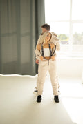 Couple in beige Ninja jumpsuits on suspenders, tops lowered (option on request) | THE ONE