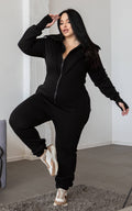 Ninja black jumpsuit in motion: doesn't restrict movement, thumbhole cuffs | THE ONE