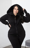Ninja black jumpsuit with its huge hood up: hourglass silhouette on a curvy figure | THE ONE
