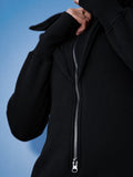 Ninja black jumpsuit close-up: massive zipper and dense knit | THE ONE