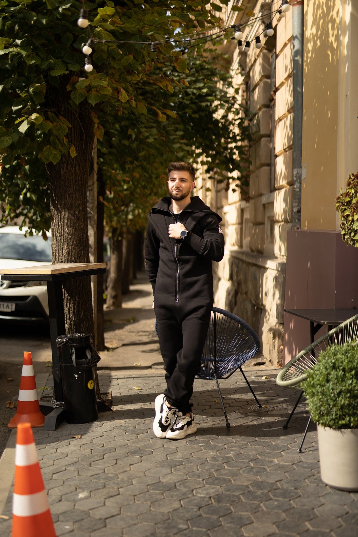 Men's Ninja black jumpsuit on a city walk | THE ONE