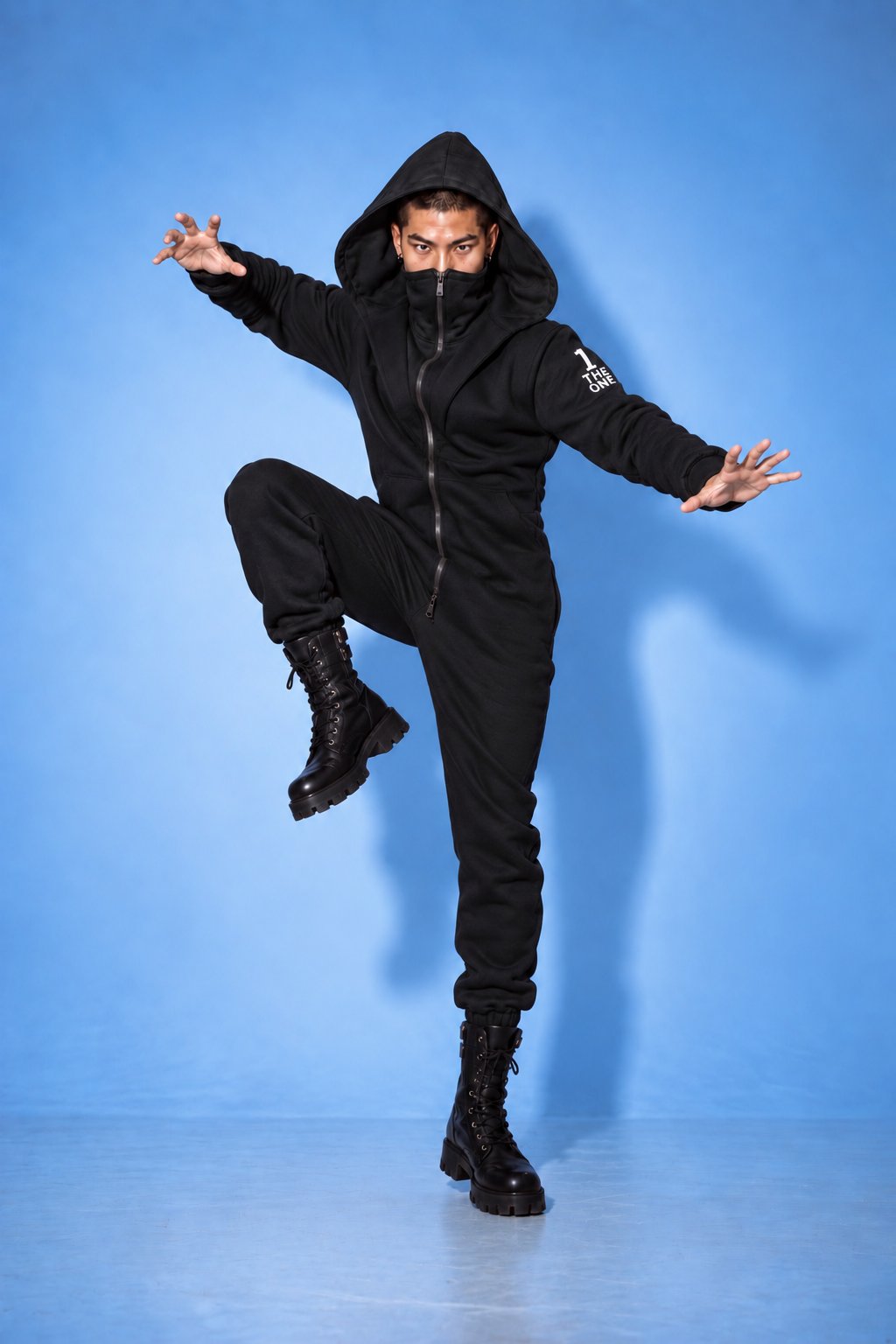 Ninja black jumpsuit in a dynamic pose: moves freely | THE ONE