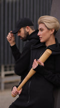 Couple in black Ninja jumpsuits with a baseball bat: street look | THE ONE