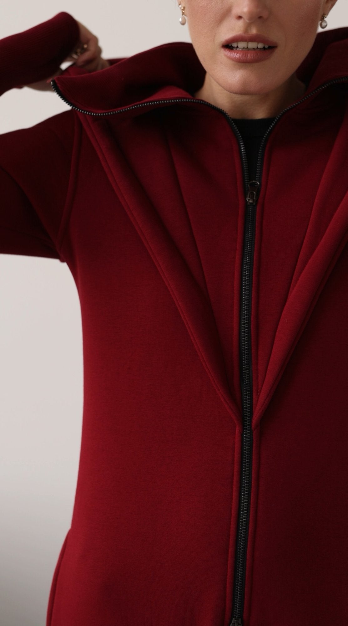 Ninja wine jumpsuit close-up: massive zipper and dense knit | THE ONE
