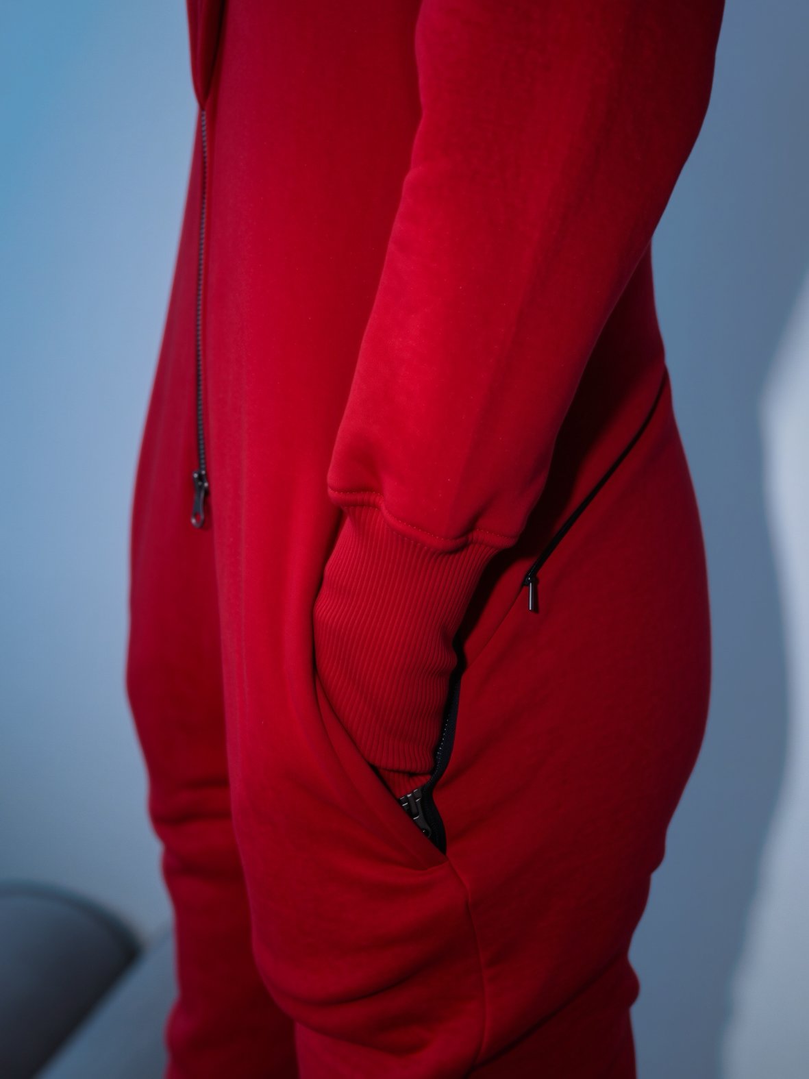 Zippered side pocket on the Ninja wine jumpsuit, close-up | THE ONE