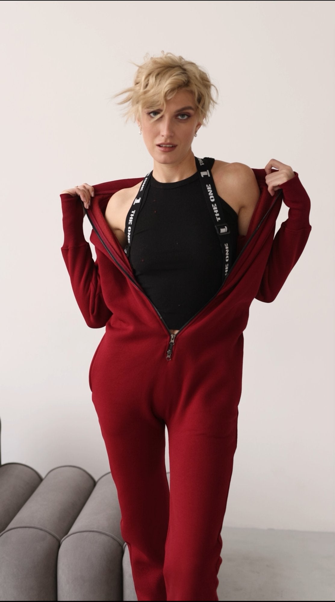 Suspenders on the Ninja wine jumpsuit, top lowered (option on request) | THE ONE