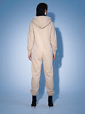 Original beige jumpsuit, back view: one-piece cut, lower back covered | THE ONE