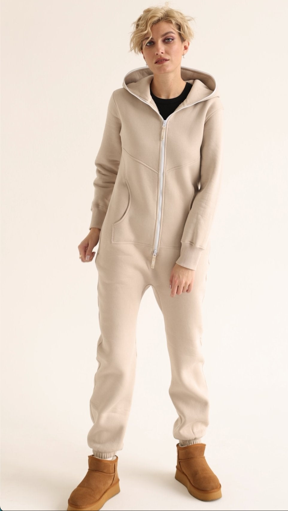 Original beige jumpsuit with hood, front view with boots | THE ONE
