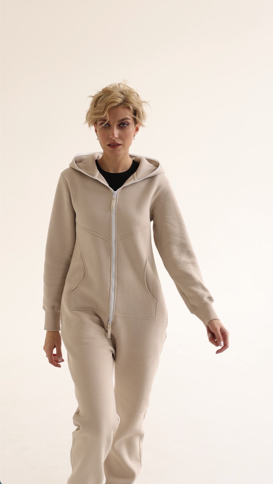 Original beige jumpsuit, three-quarter view: fitted, not baggy | THE ONE