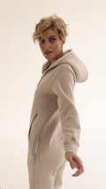 Original beige jumpsuit, side view: zippered pockets | THE ONE