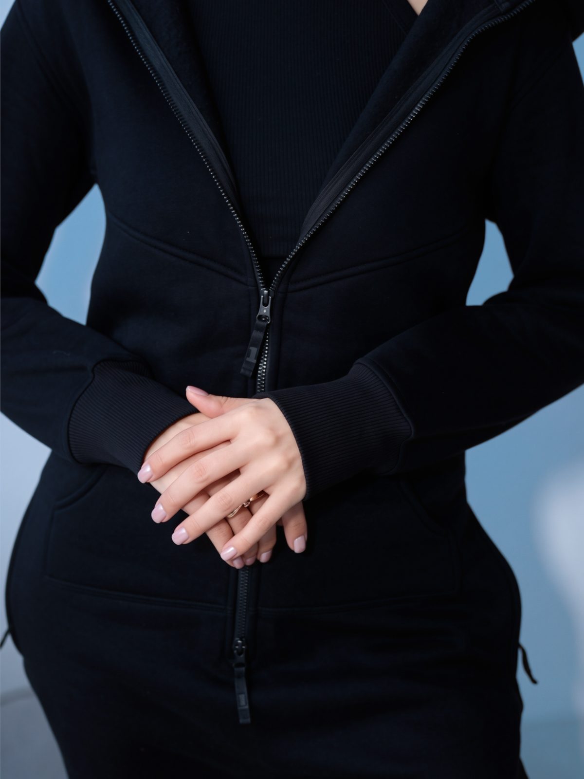 Original black jumpsuit close-up: dense fabric and full-length zipper | THE ONE