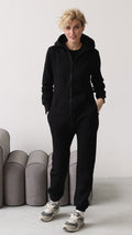 Women's warm fleece-lined jumpsuit Original black, full length, hands in pockets | THE ONE