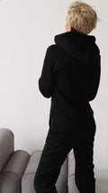 Original black jumpsuit with hood, back close-up | THE ONE