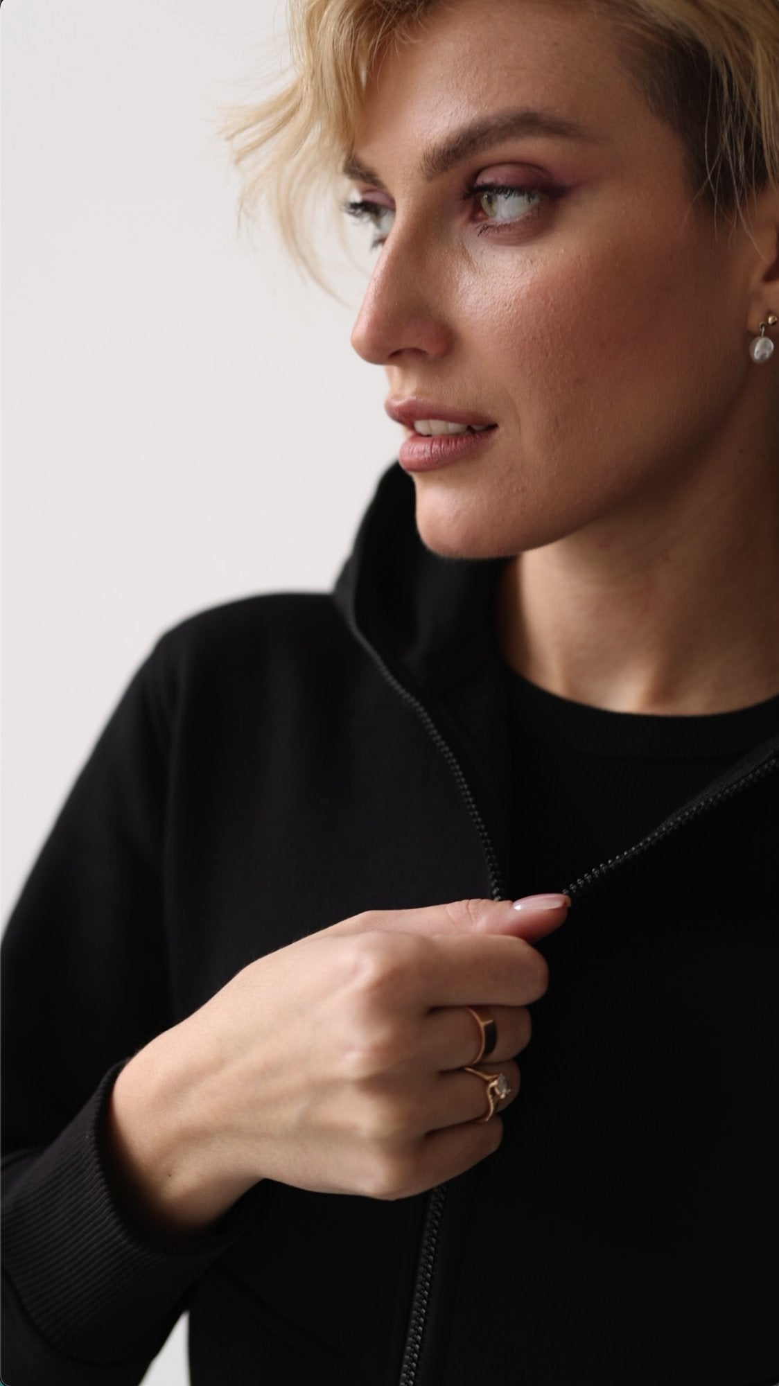 Original black jumpsuit, hood and zipper close-up | THE ONE