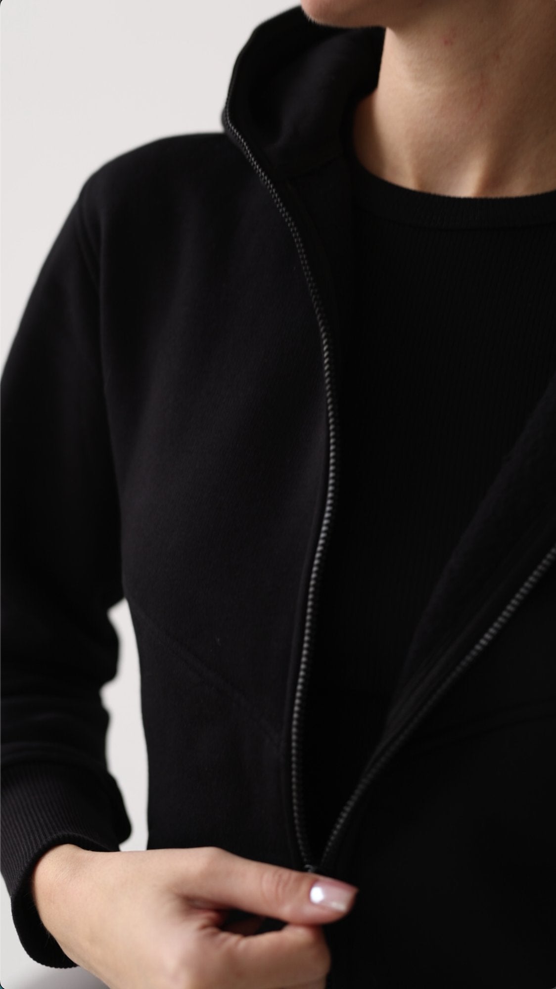 Original black jumpsuit close-up: dense knit and zipper | THE ONE