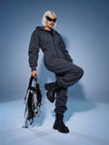 Original graphite jumpsuit with knee raised: moves freely | THE ONE