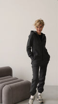 Original graphite jumpsuit, front view: minimalist silhouette | THE ONE