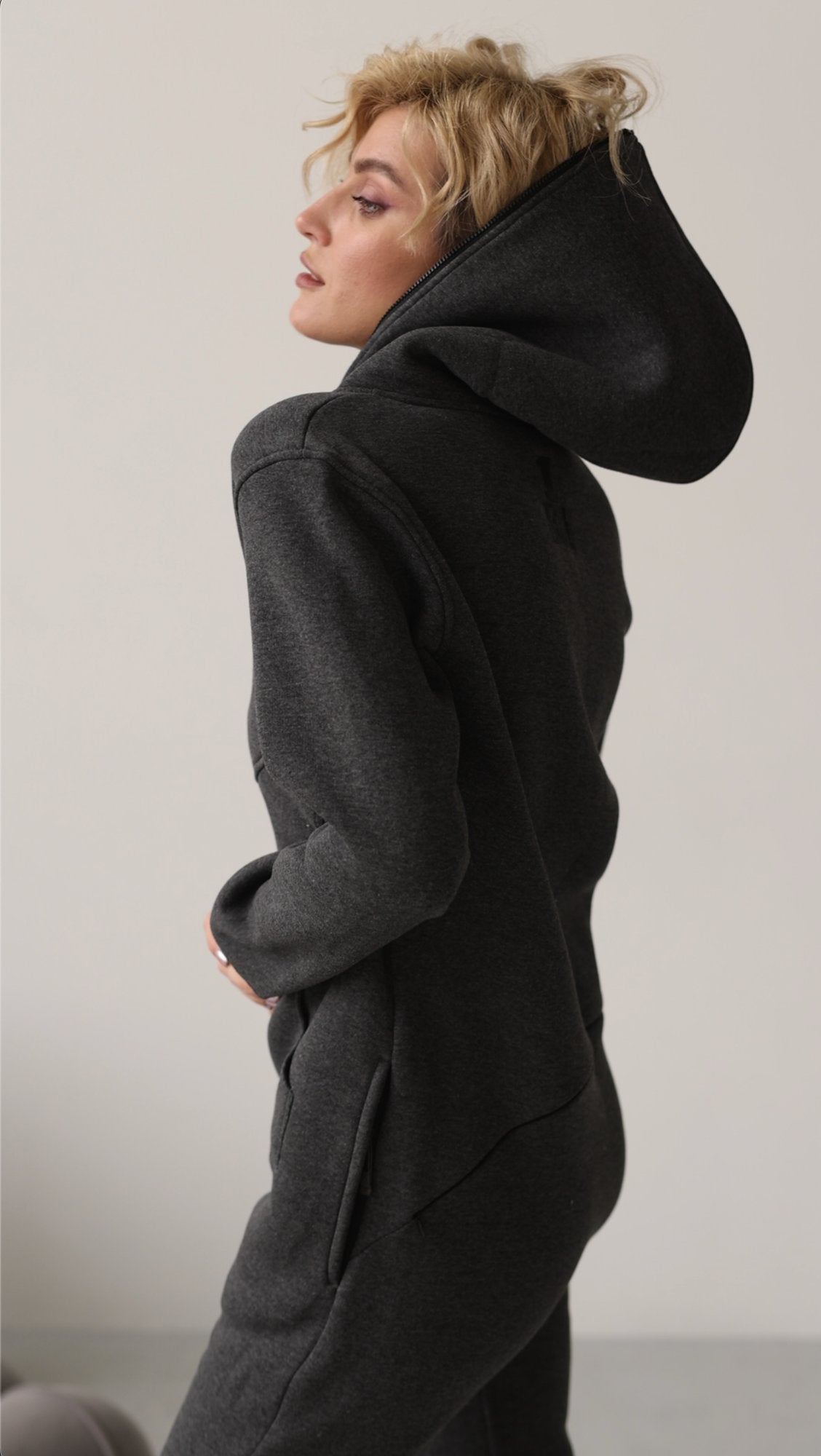 Original graphite jumpsuit, side view with hood up | THE ONE