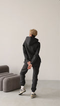 Original graphite jumpsuit in motion, full length | THE ONE