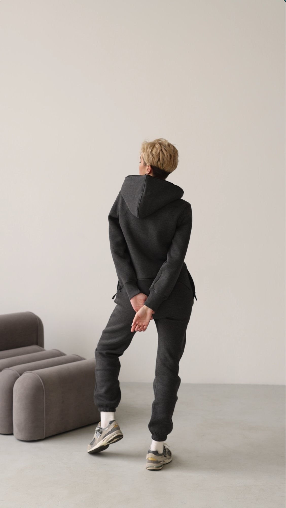 Original graphite jumpsuit in motion, full length | THE ONE