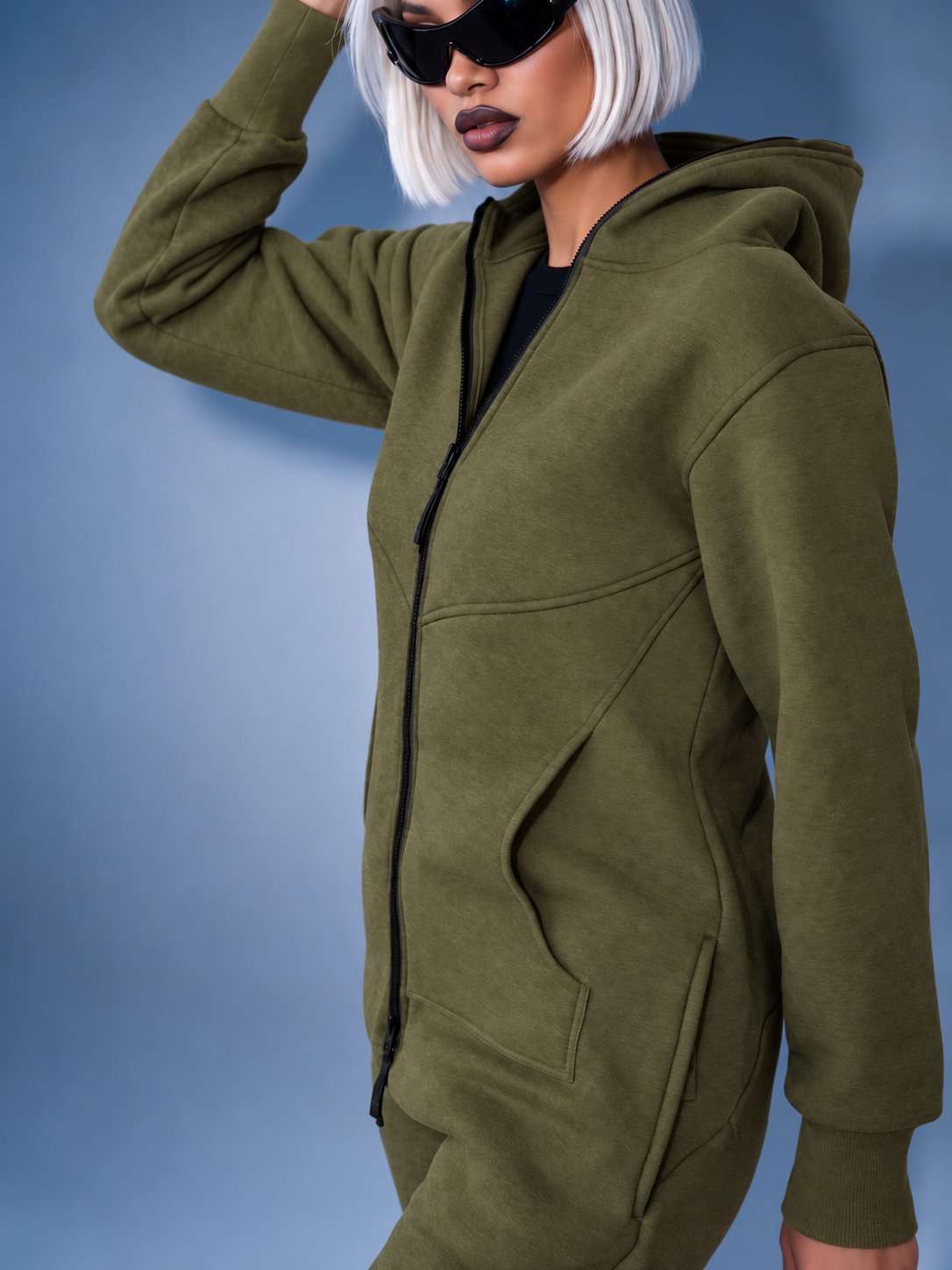Original khaki jumpsuit with hood, three-quarter view: fitted silhouette | THE ONE