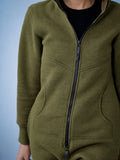 Original khaki jumpsuit close-up: dense knit and full-length zipper | THE ONE