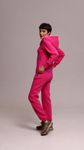 Original pink jumpsuit, side view: fitted, not baggy | THE ONE