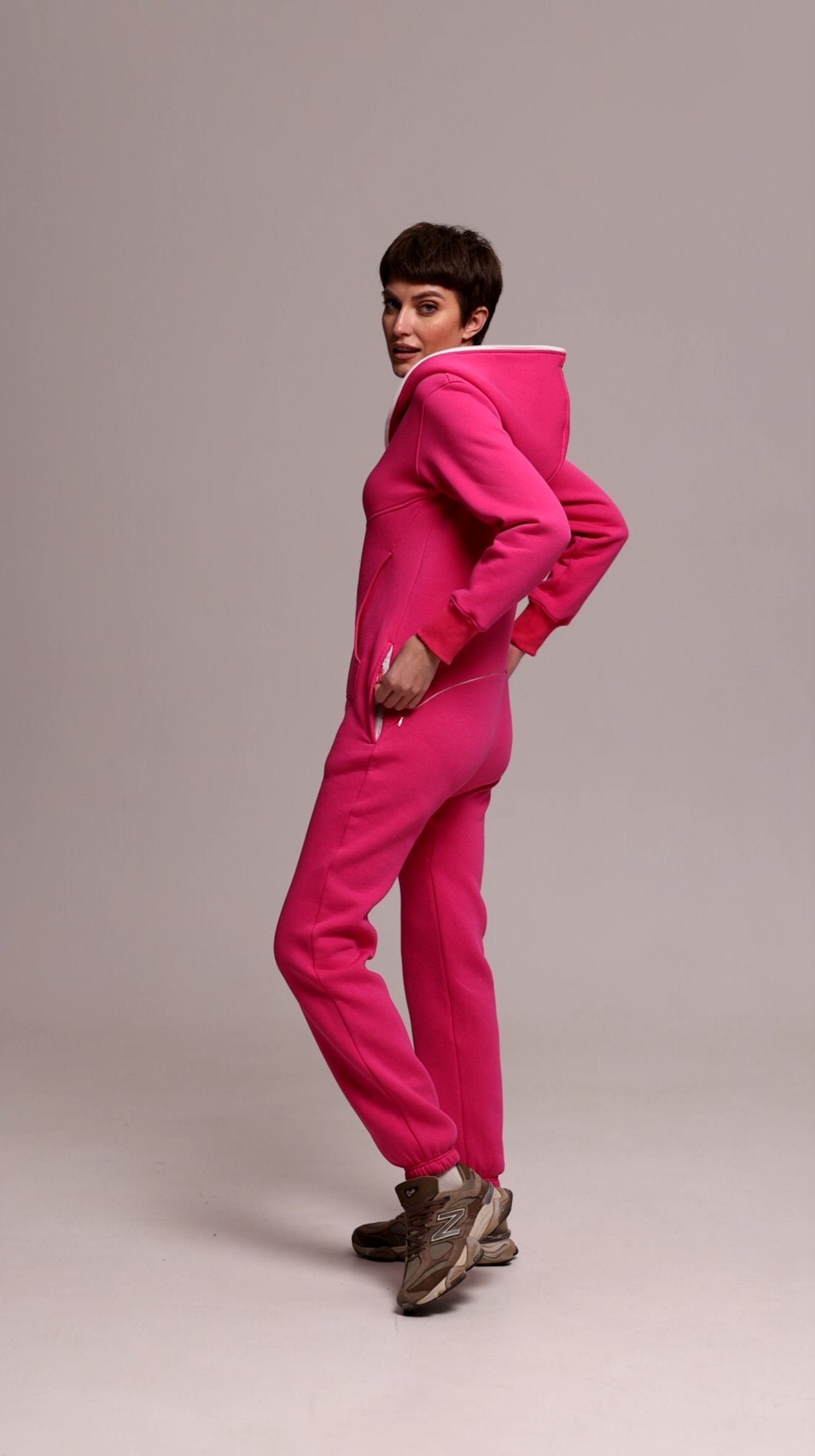 Original pink jumpsuit, side view: fitted, not baggy | THE ONE