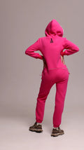 Original pink jumpsuit, back view: one-piece cut, lower back covered | THE ONE