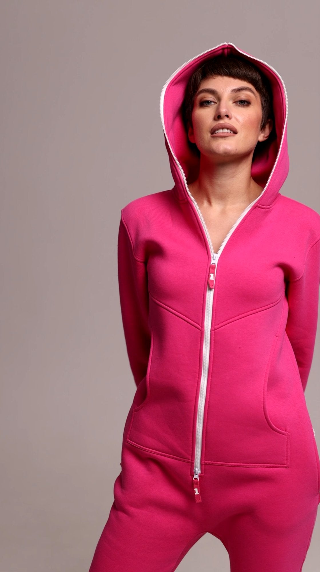 Original pink jumpsuit with hood up: warm and cozy | THE ONE