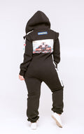 Race black jumpsuit, back view: racing car print on the hood, one-piece cut keeps the back covered | THE ONE