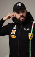 Men's Race black jumpsuit close-up: racing patches and stripes, hood | THE ONE